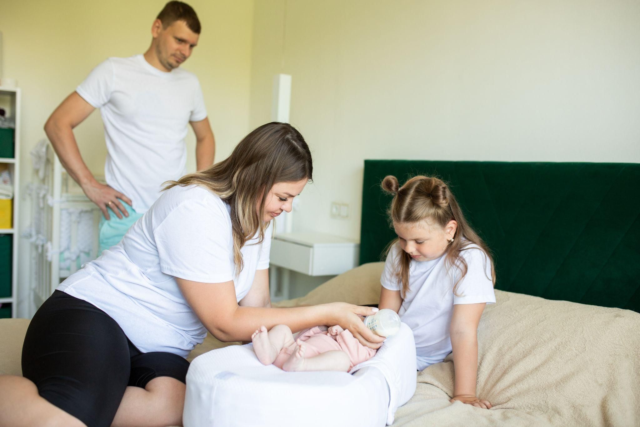 A peaceful home birth setup with a birthing pool and soft lighting.