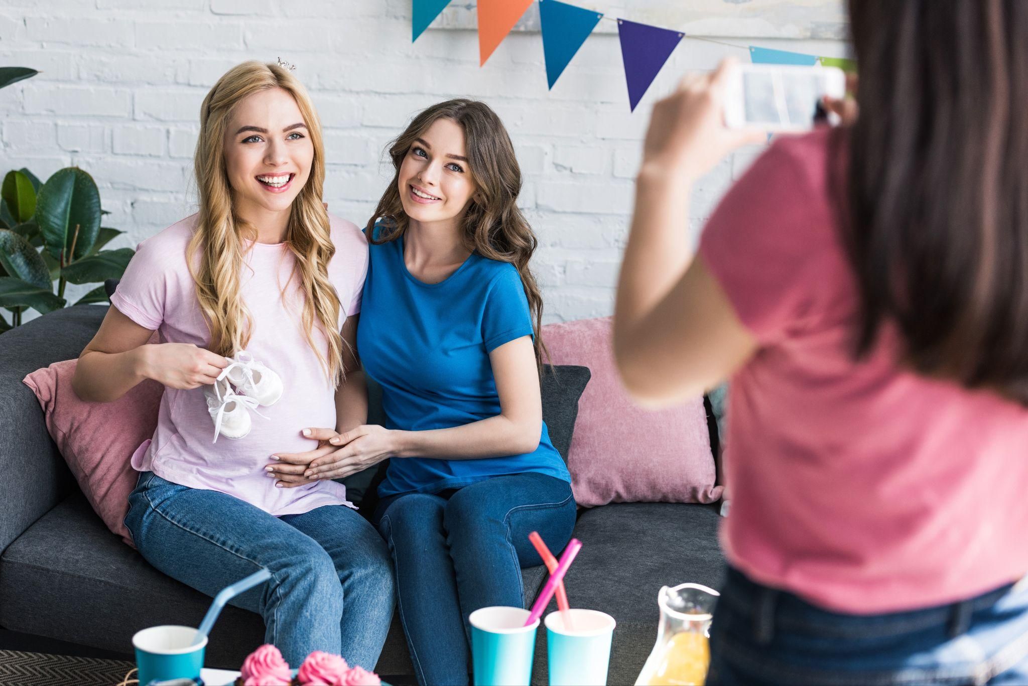 Pregnancy influencer photographed at baby shower.