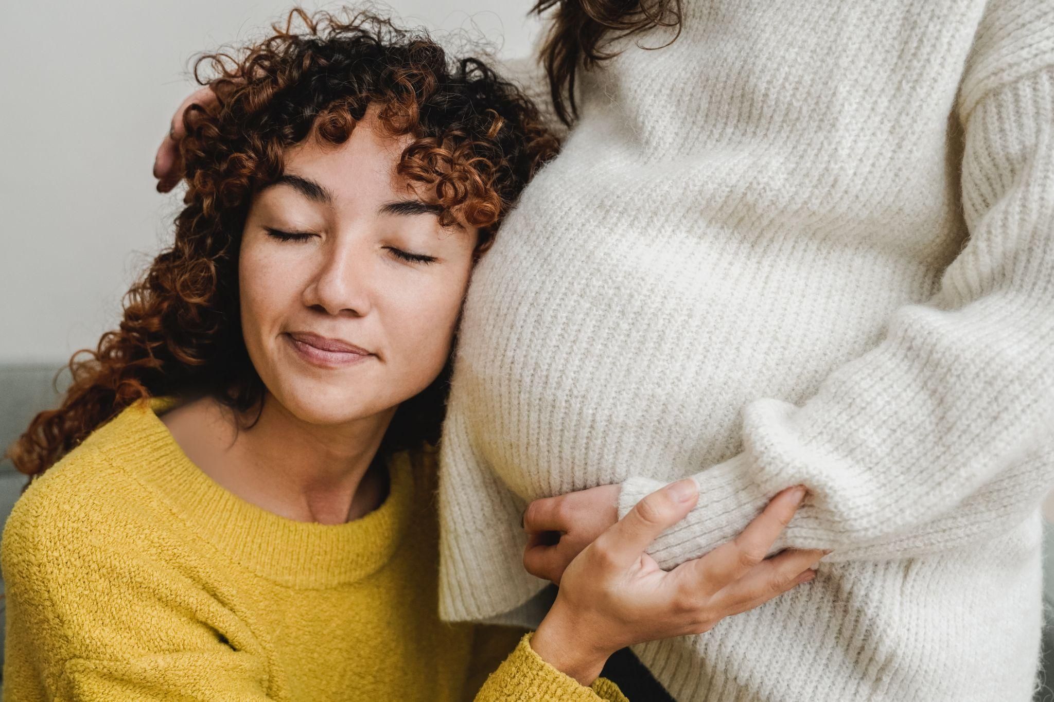 A serene pregnant woman bonding with her baby in the womb.