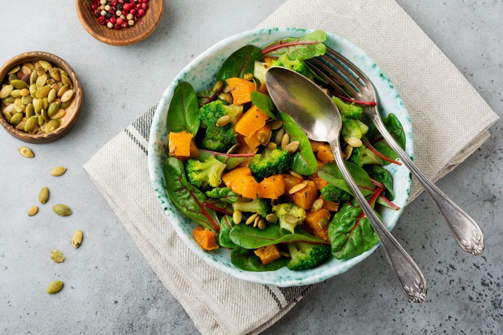 A healthy pregnancy meal with leafy greens, sweet potatoes, and avocado, rich in essential nutrients for the third trimester.