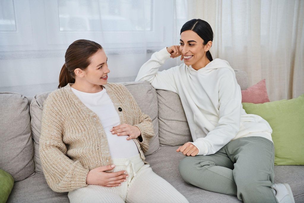 Expectant mother and partner receiving emotional support during labour and birth.