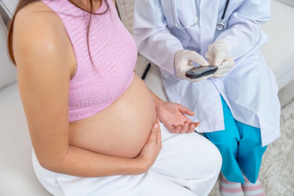 A healthcare provider discussing antenatal care with a pregnant woman.