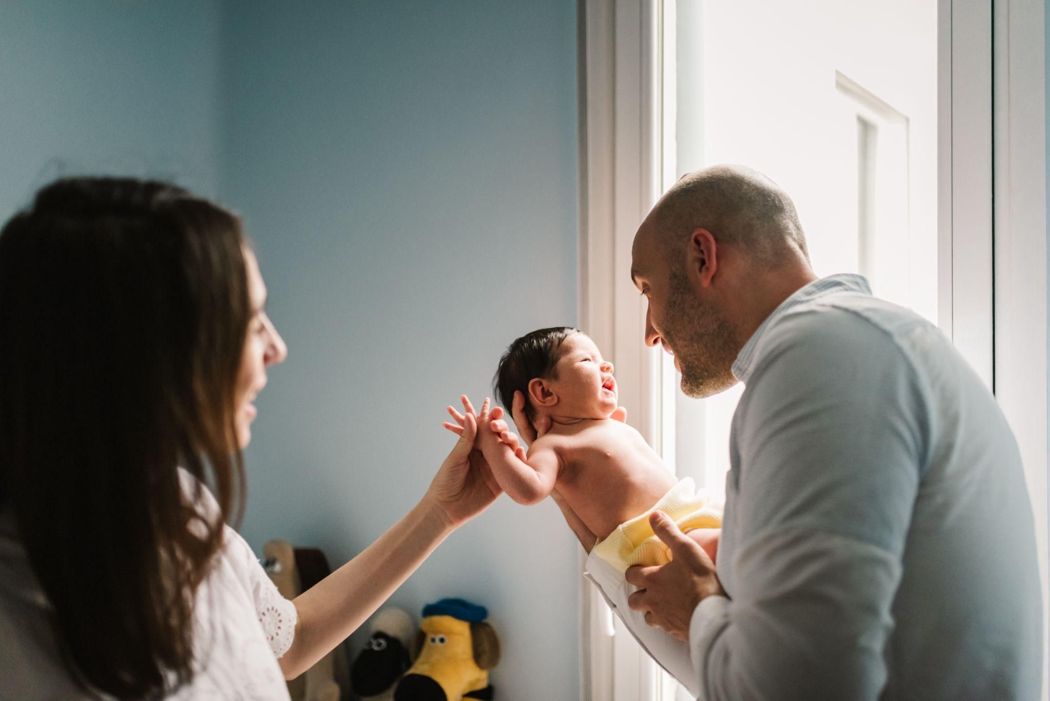 A midwife supporting a mother during a home birth in the UK.