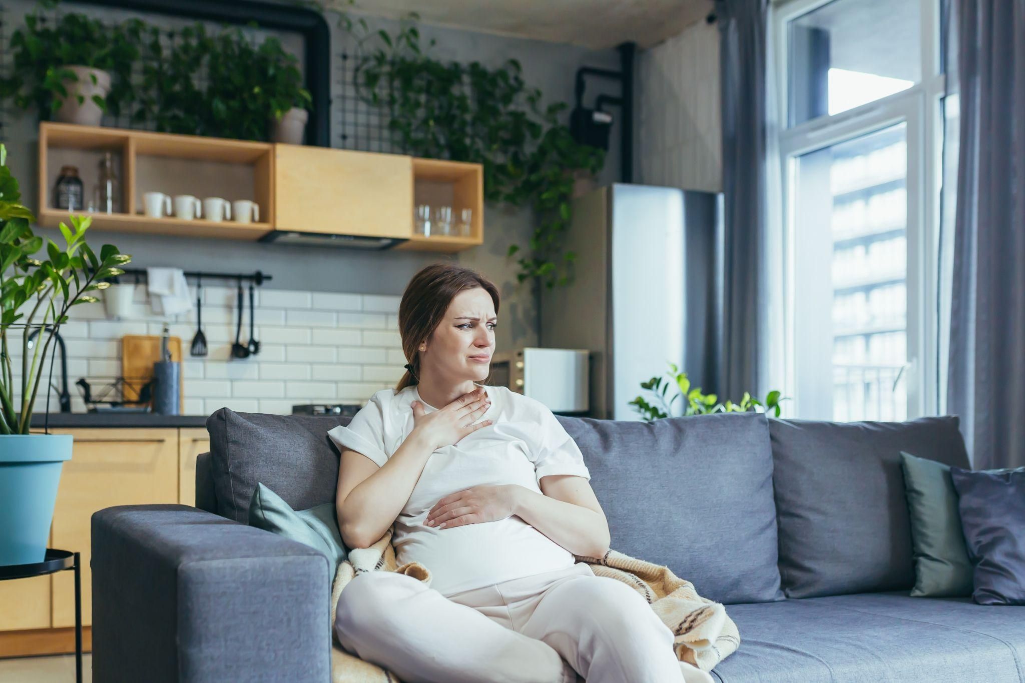 Pregnant woman engaging in antenatal yoga as part of her self-care routine.