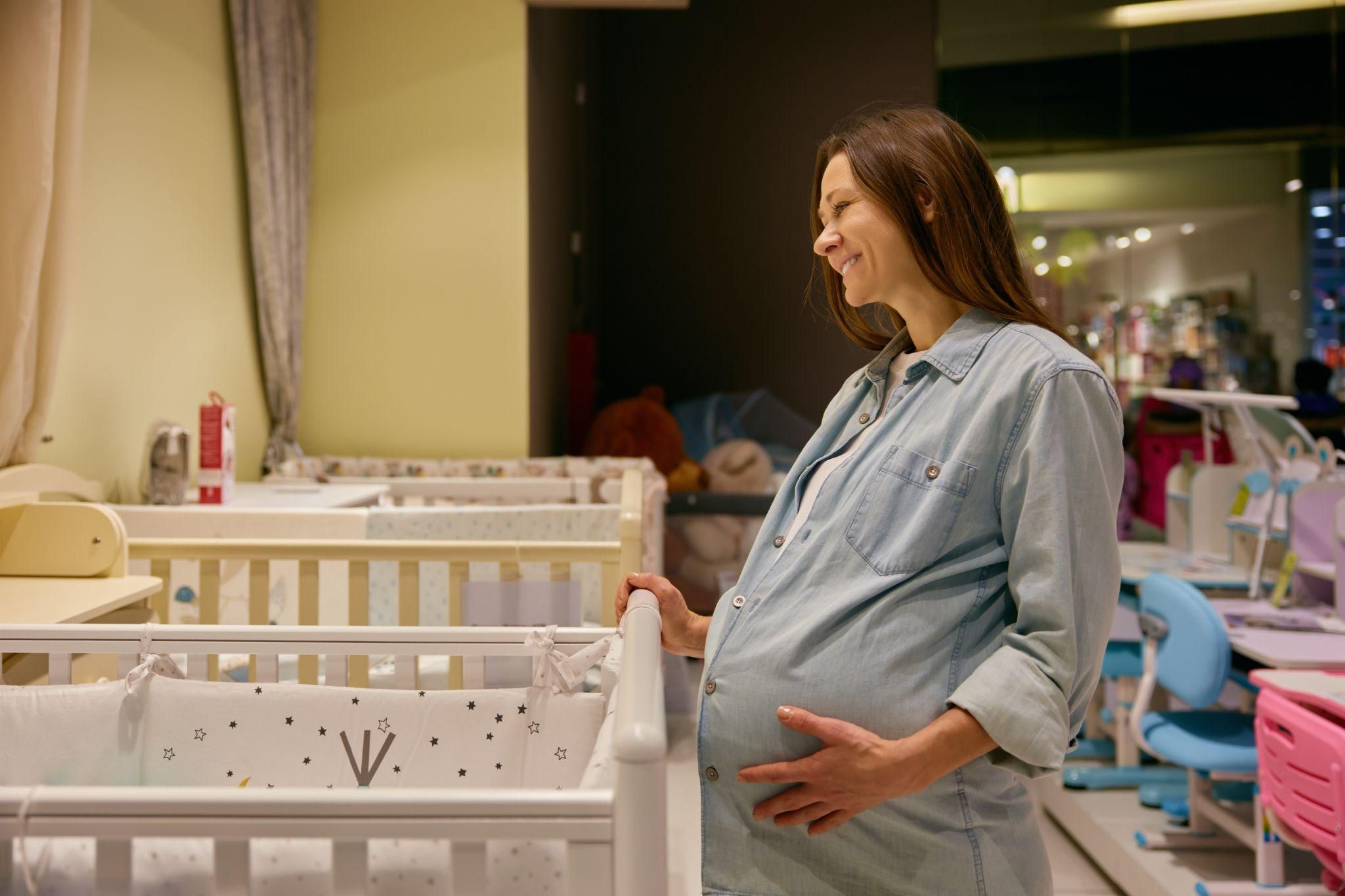 A healthcare professional teaching safe sleep practices at an antenatal class.