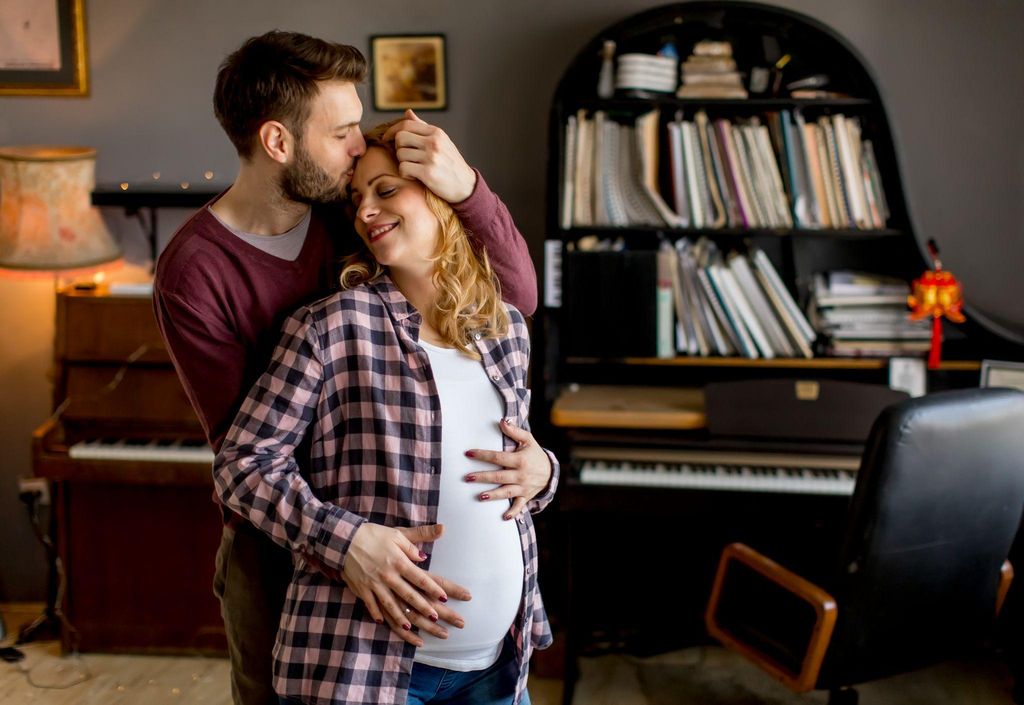 Loving Pregnant Couple at Home