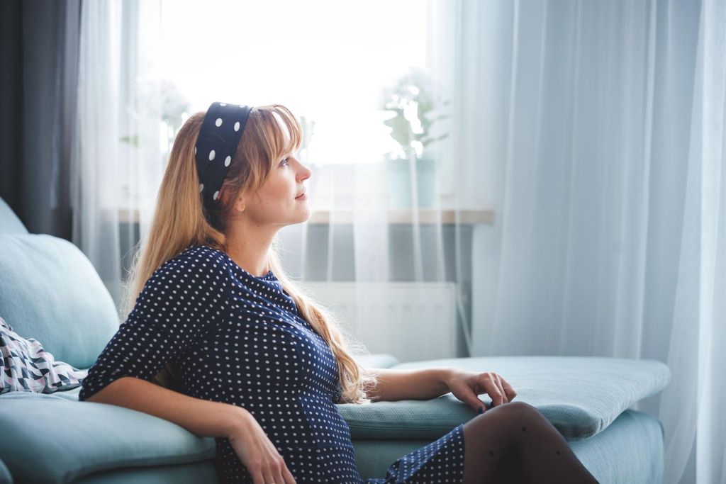 Pregnant woman receiving therapy during pregnancy for emotional well-being.