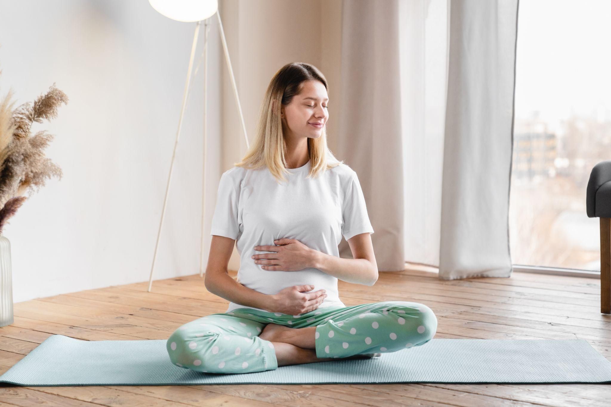 Pregnant woman attending antenatal appointment with midwife