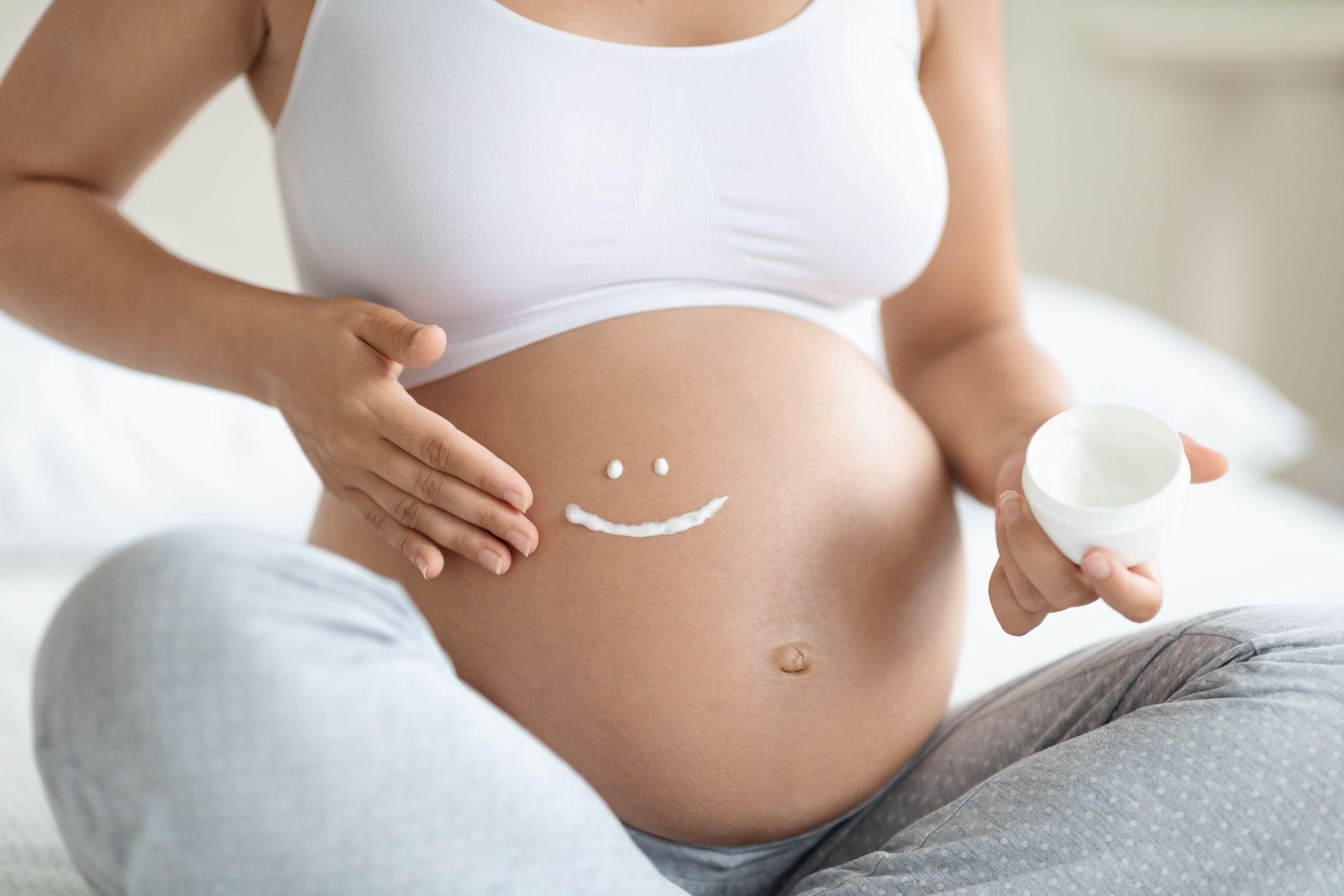 Pregnant woman enjoying the final trimester with a smile on her face.