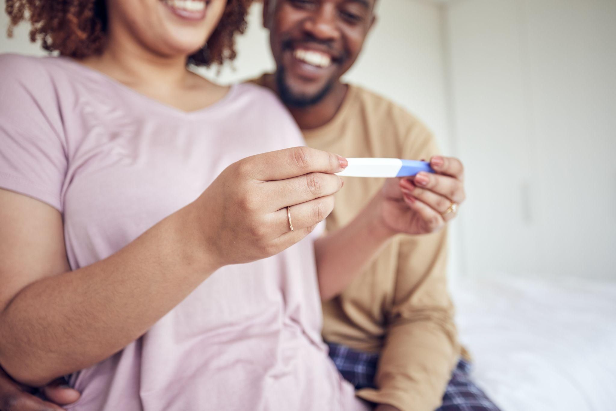 A woman performing pregnancy test in a serene environment.