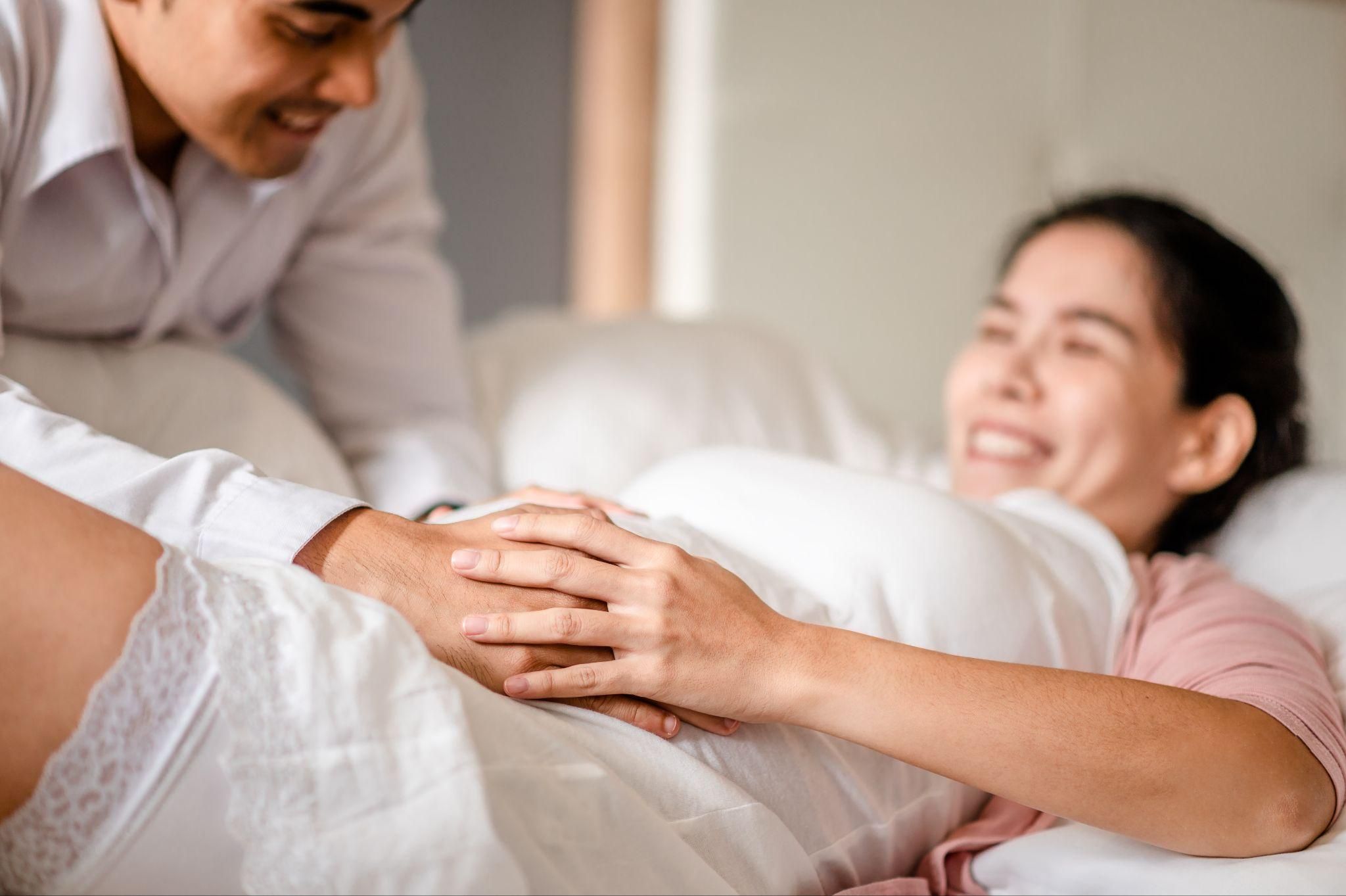 An expectant mother consulting with her midwife about home birth options.