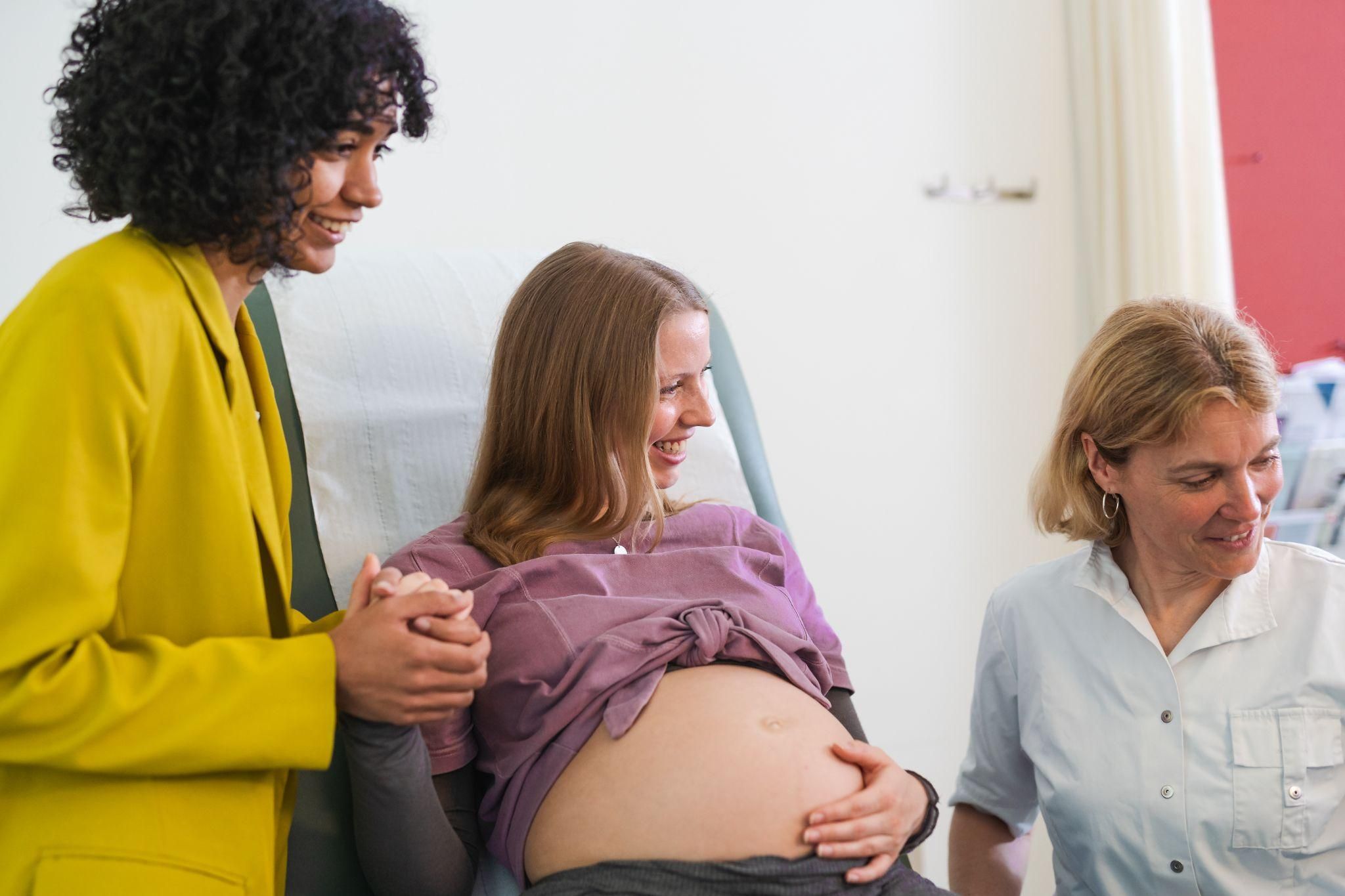 Pregnant woman learning about antenatal care during a group antenatal class.