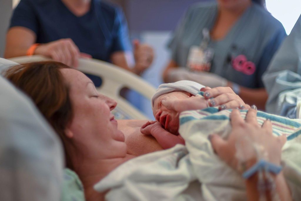 A doctor and expectant mother reviewing plans for an elective C-section.