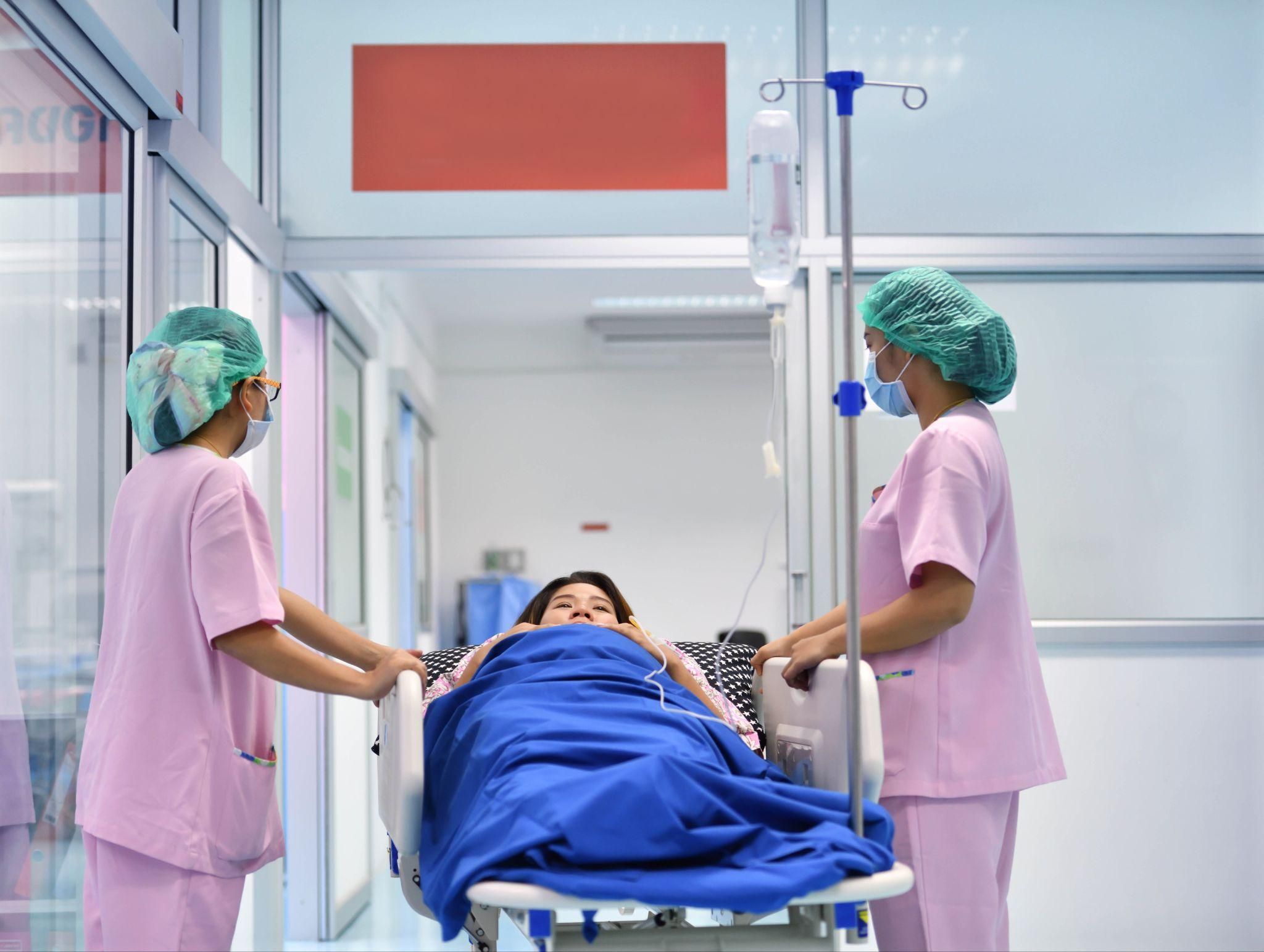 A mother bonding with her baby after recovering from a C-section.