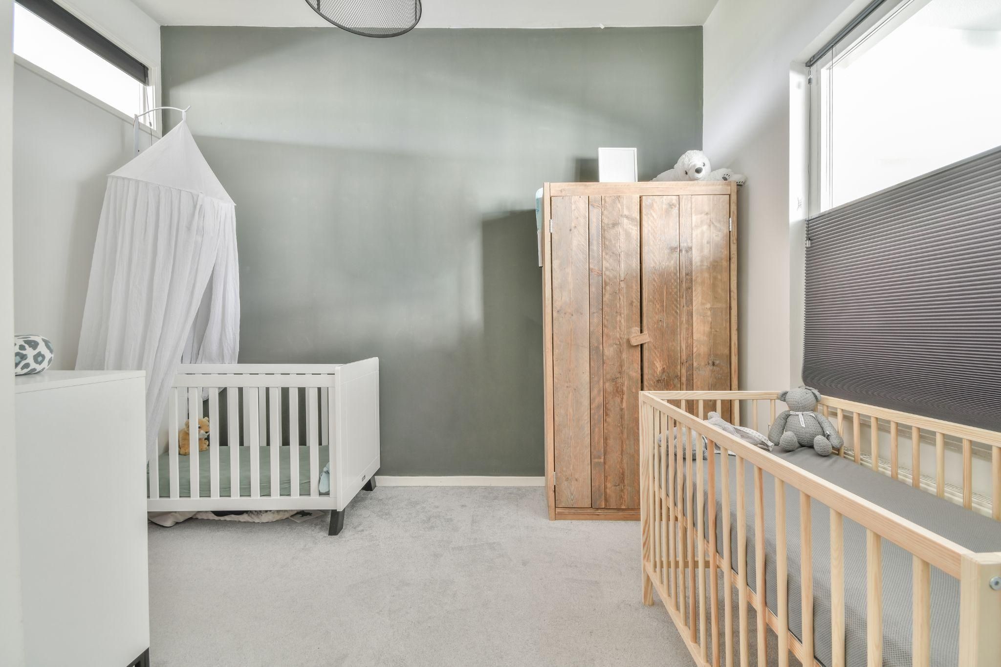 A cosy, minimalist baby room with second-hand furniture and affordable decor.