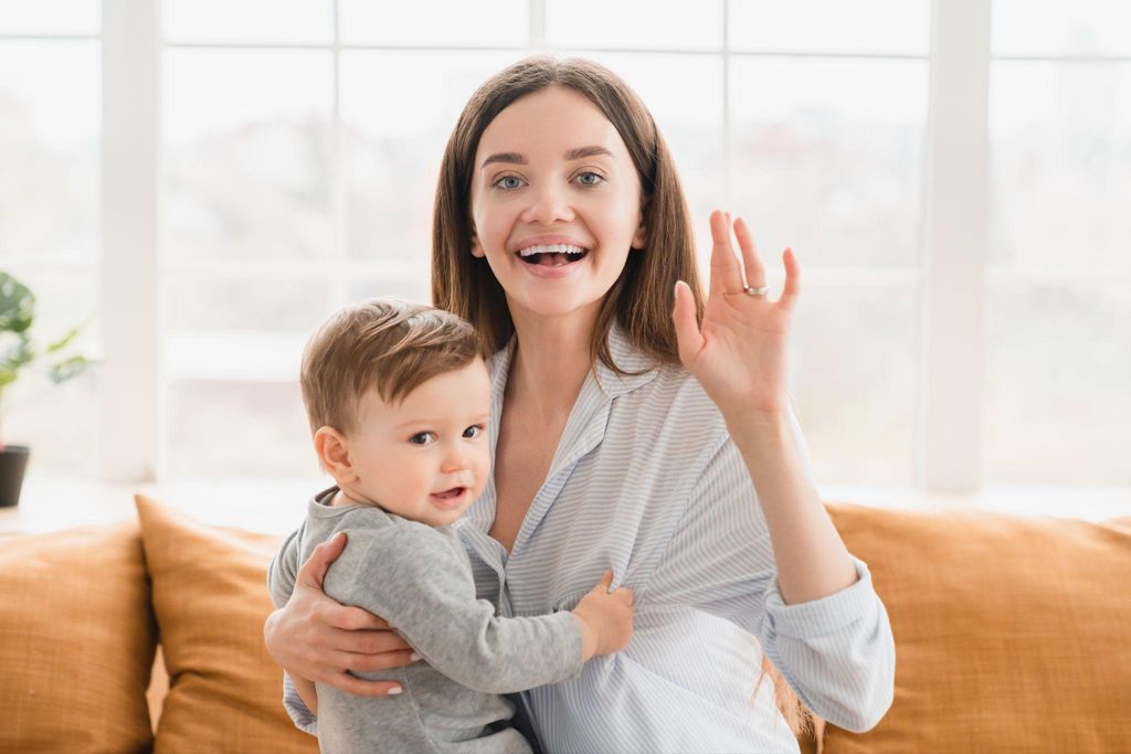 Expectant mother with toddler, discussing the arrival of a new sibling.