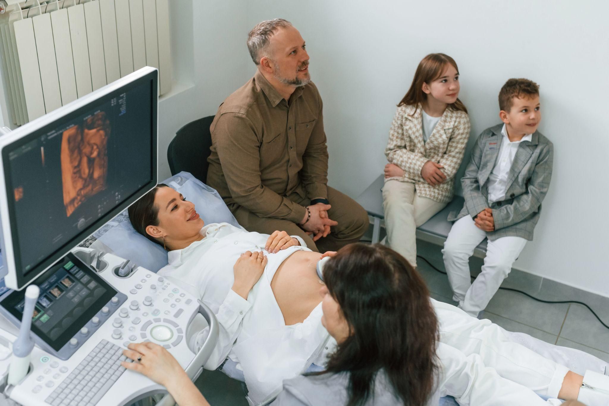 Parent looking at an ultrasound scan and thinking about the baby’s gender.