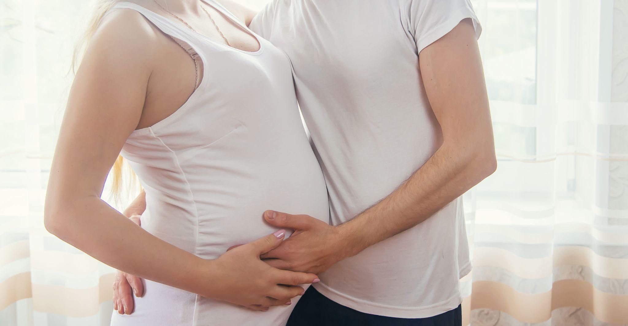 A group of pregnant women learning natural birth techniques in an antenatal class.