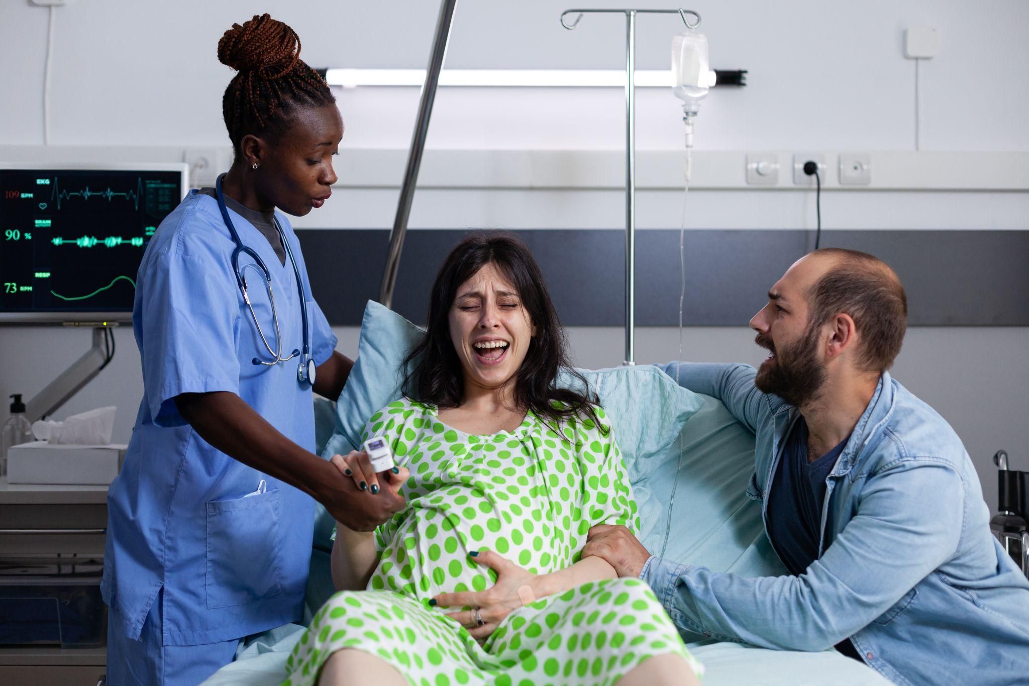 Pregnant woman receiving care during an antenatal appointment.