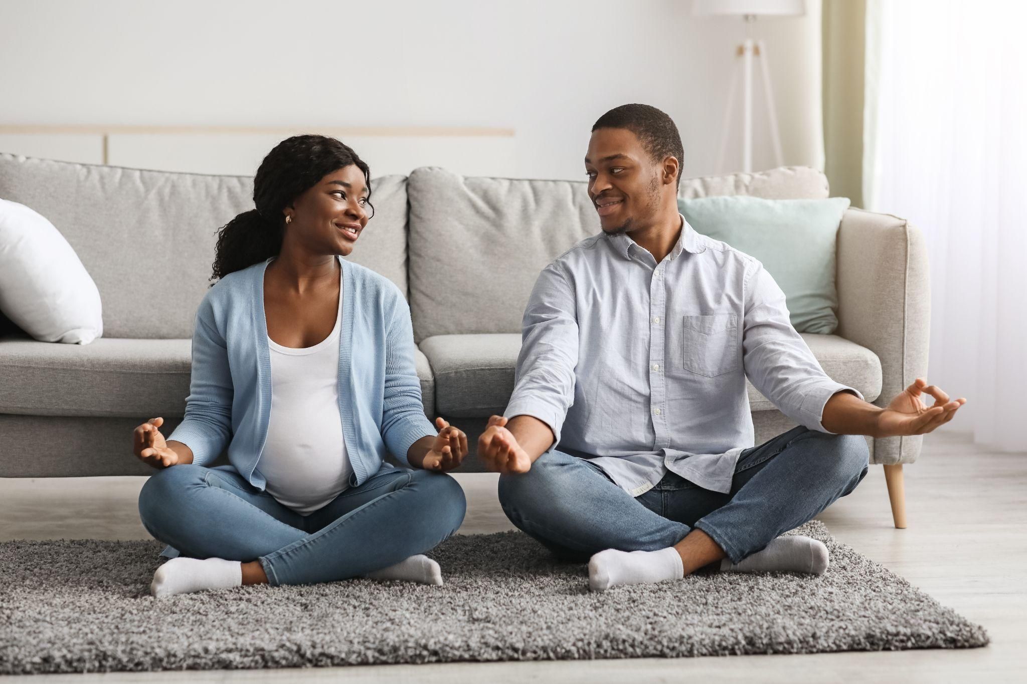 A couple attending an antenatal class, learning about pregnancy and childbirth.