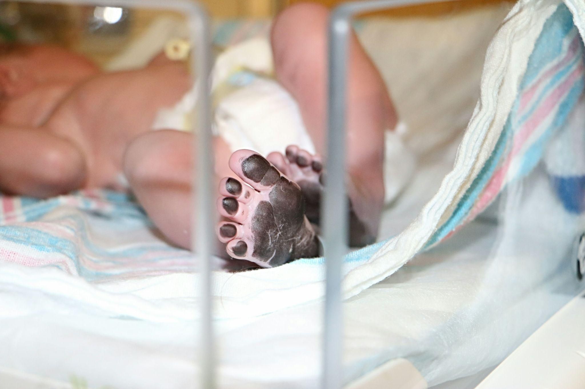 A midwife explaining Kiwi cup delivery during an antenatal class to expectant parents.