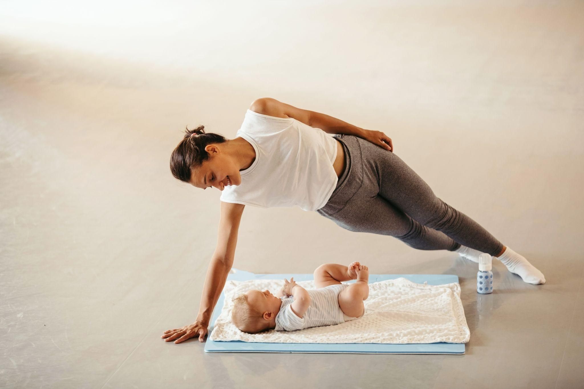 A mother engaging in postnatal yoga, rebuilding strength and body confidence after giving birth.