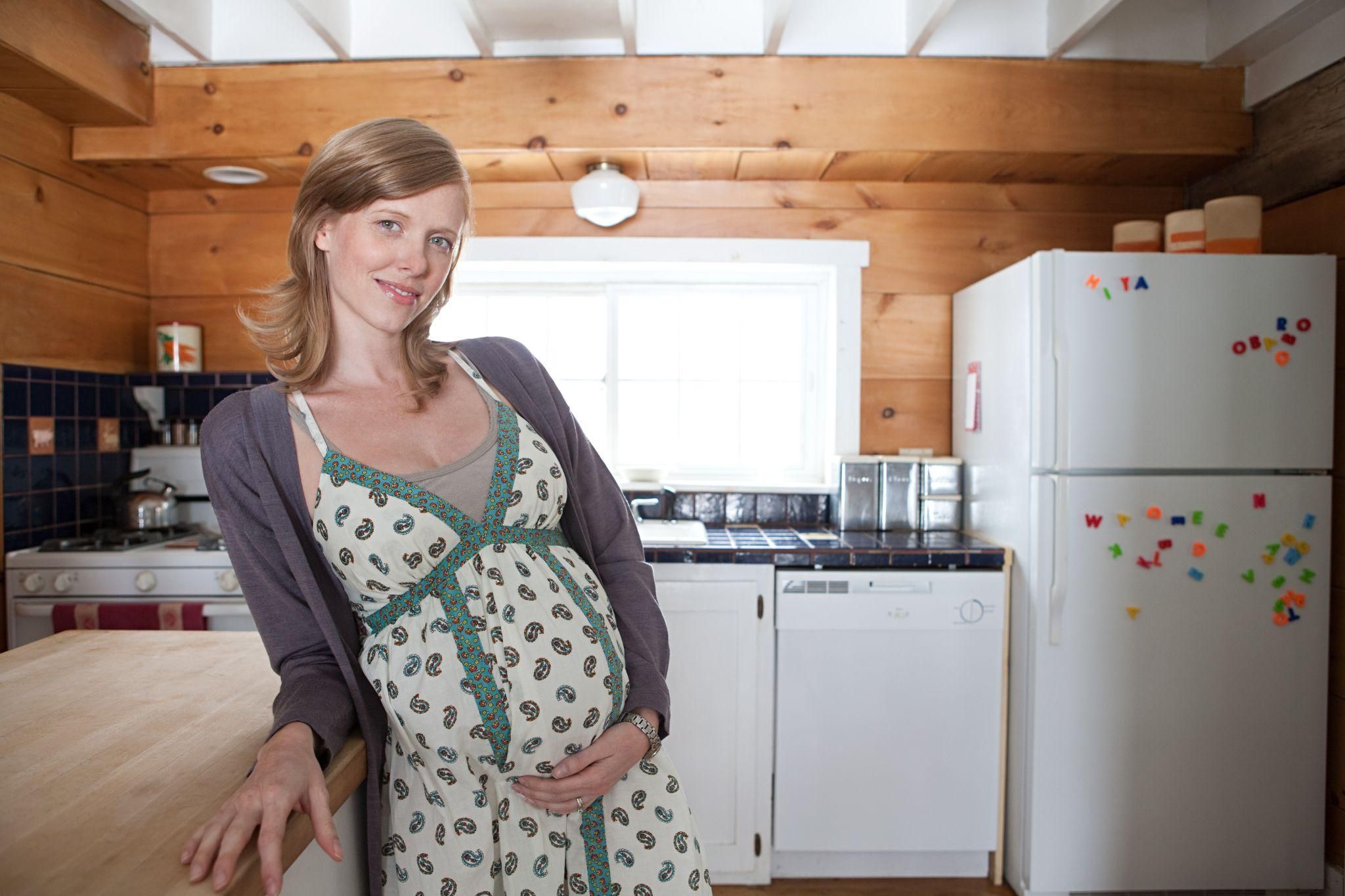 Expectant parents discussing their birth plan with their midwife.