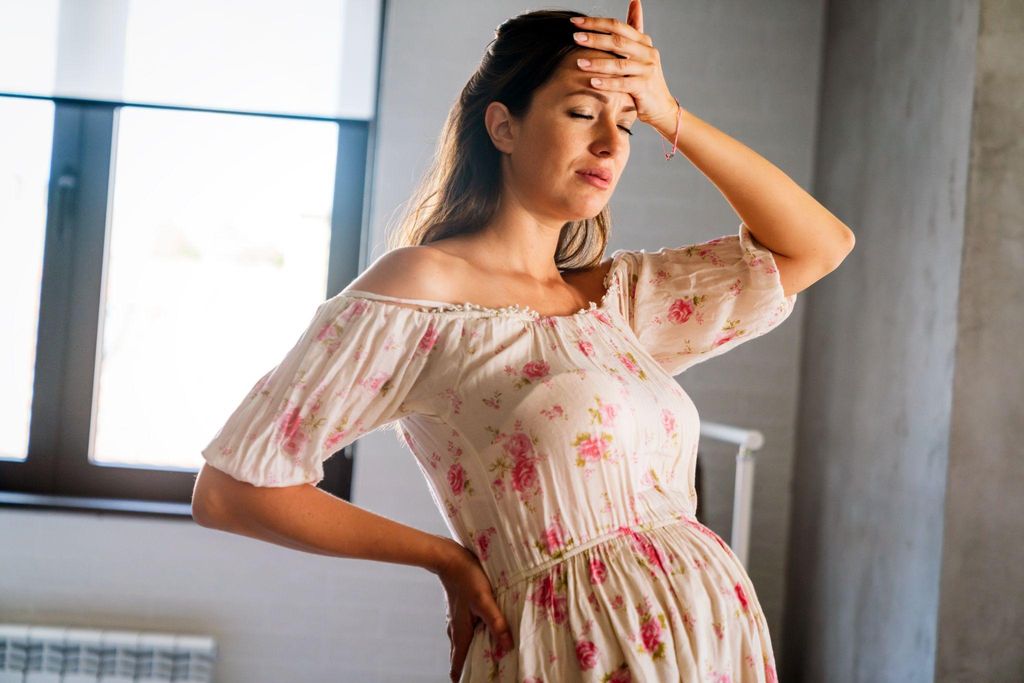 A woman practising breathing techniques during antenatal yoga in preparation for labour.