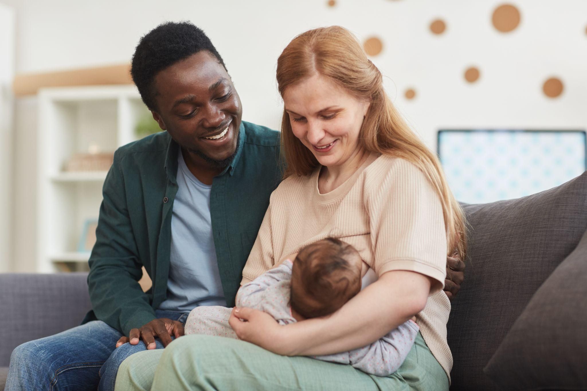 A couple bonding with their newborn baby while reconnecting emotionally.