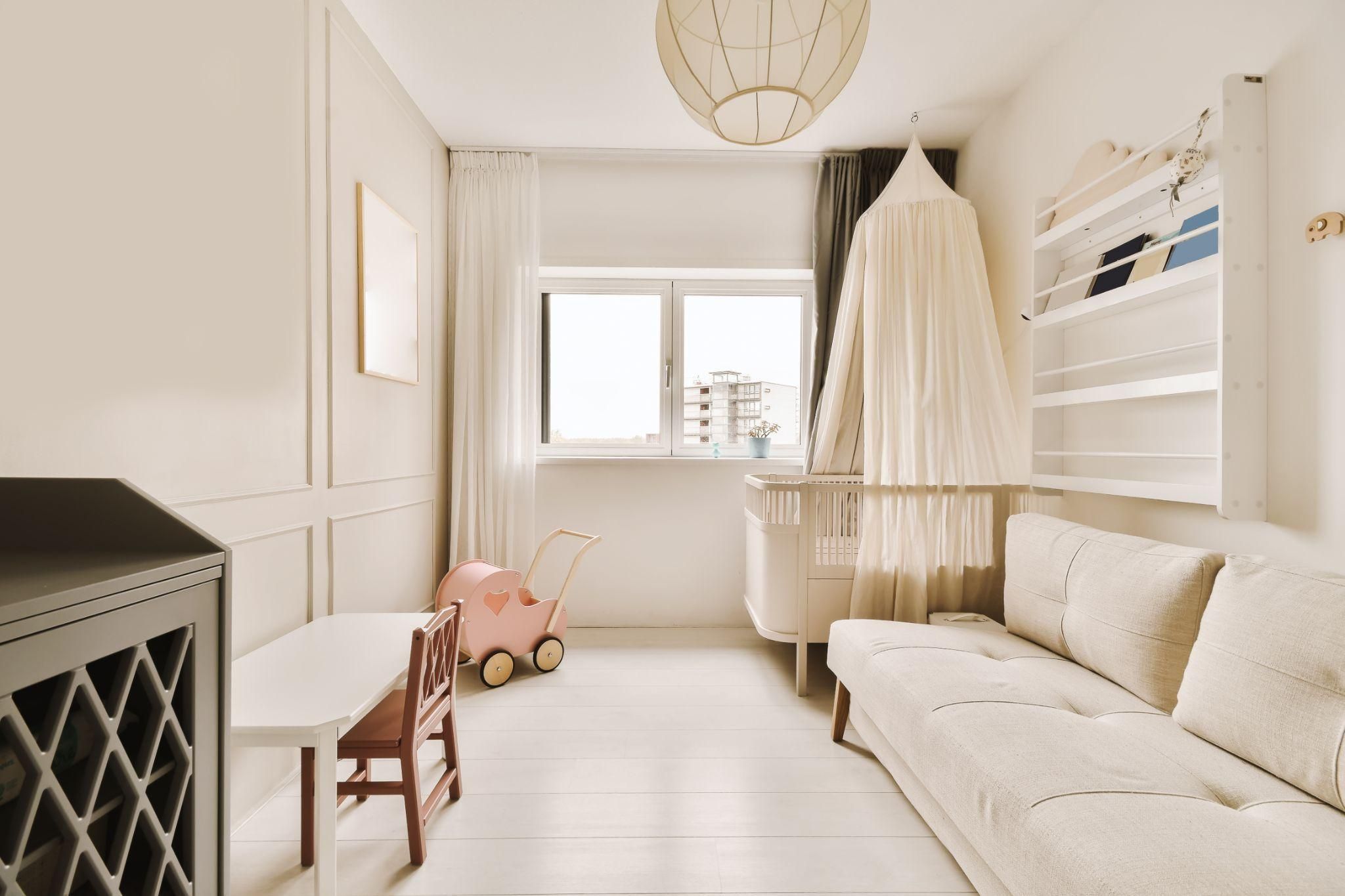 A calming nursery featuring plush textures, gentle colours, and sustainable materials.