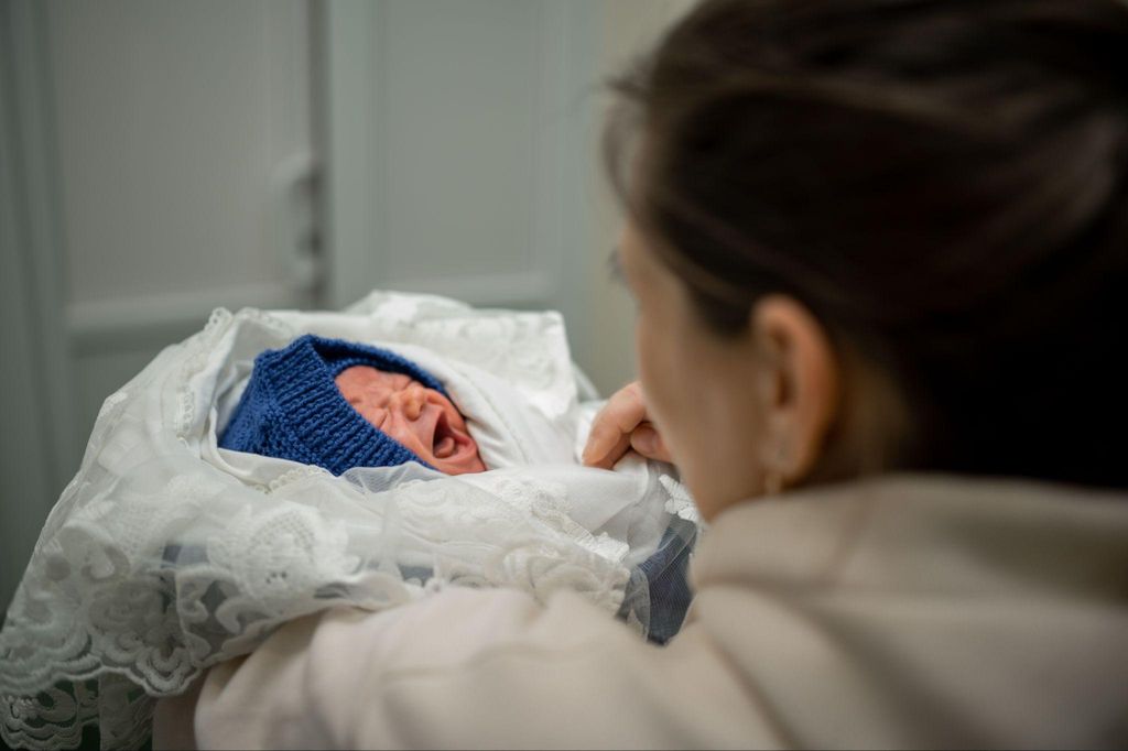 A new parent registering their baby’s birth in the UK.