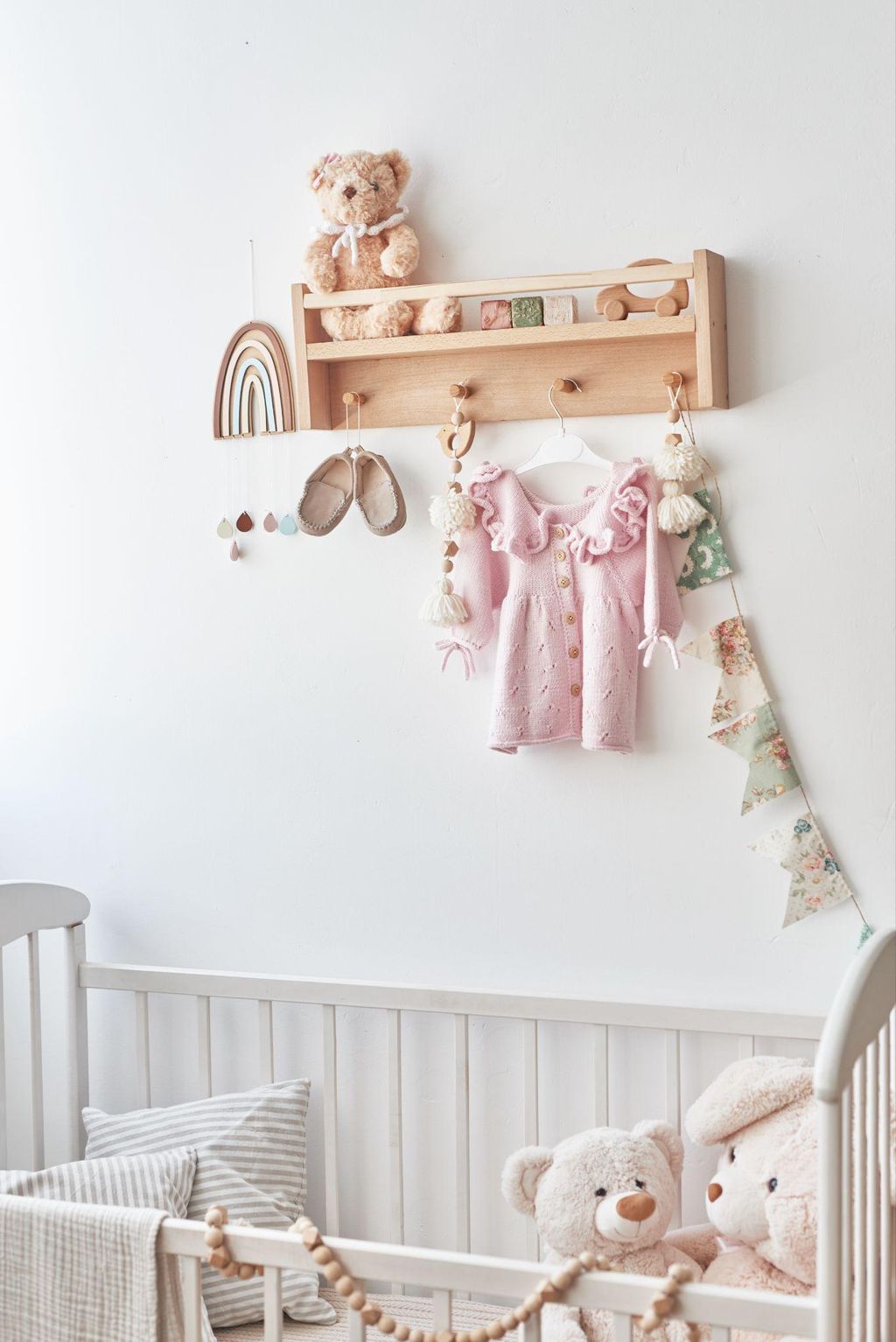 A well-designed small nursery with multi-functional furniture, light colours, and smart storage.