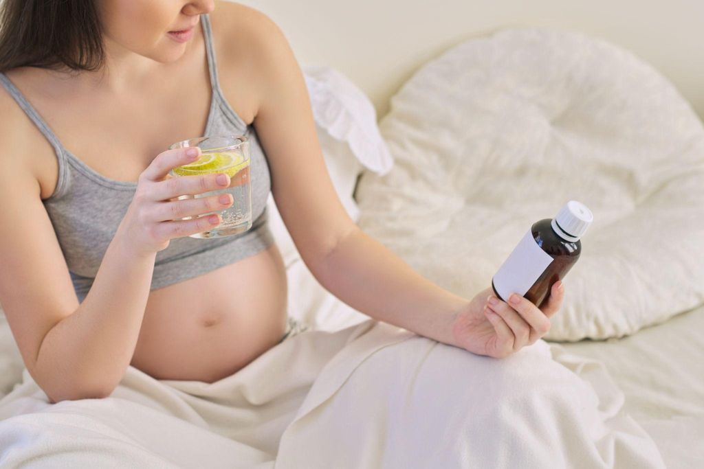 Pregnant woman considering natural labour induction methods such as castor oil