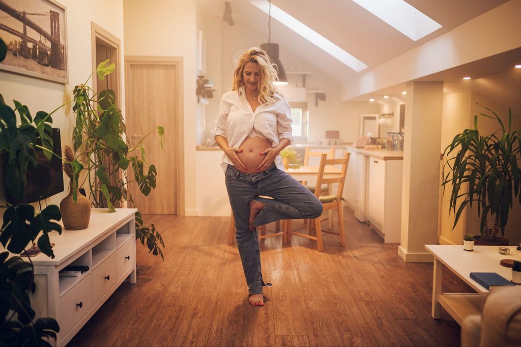 Pregnant woman participating in antenatal yoga for relaxation.