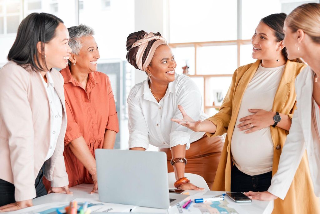 Healthcare provider helping expectant parent prepare birth plan.