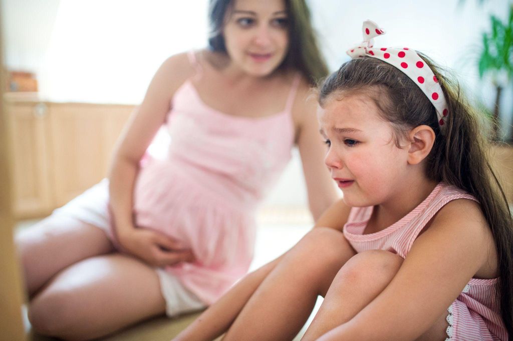 A midwife providing antenatal emotional support to a pregnant woman.