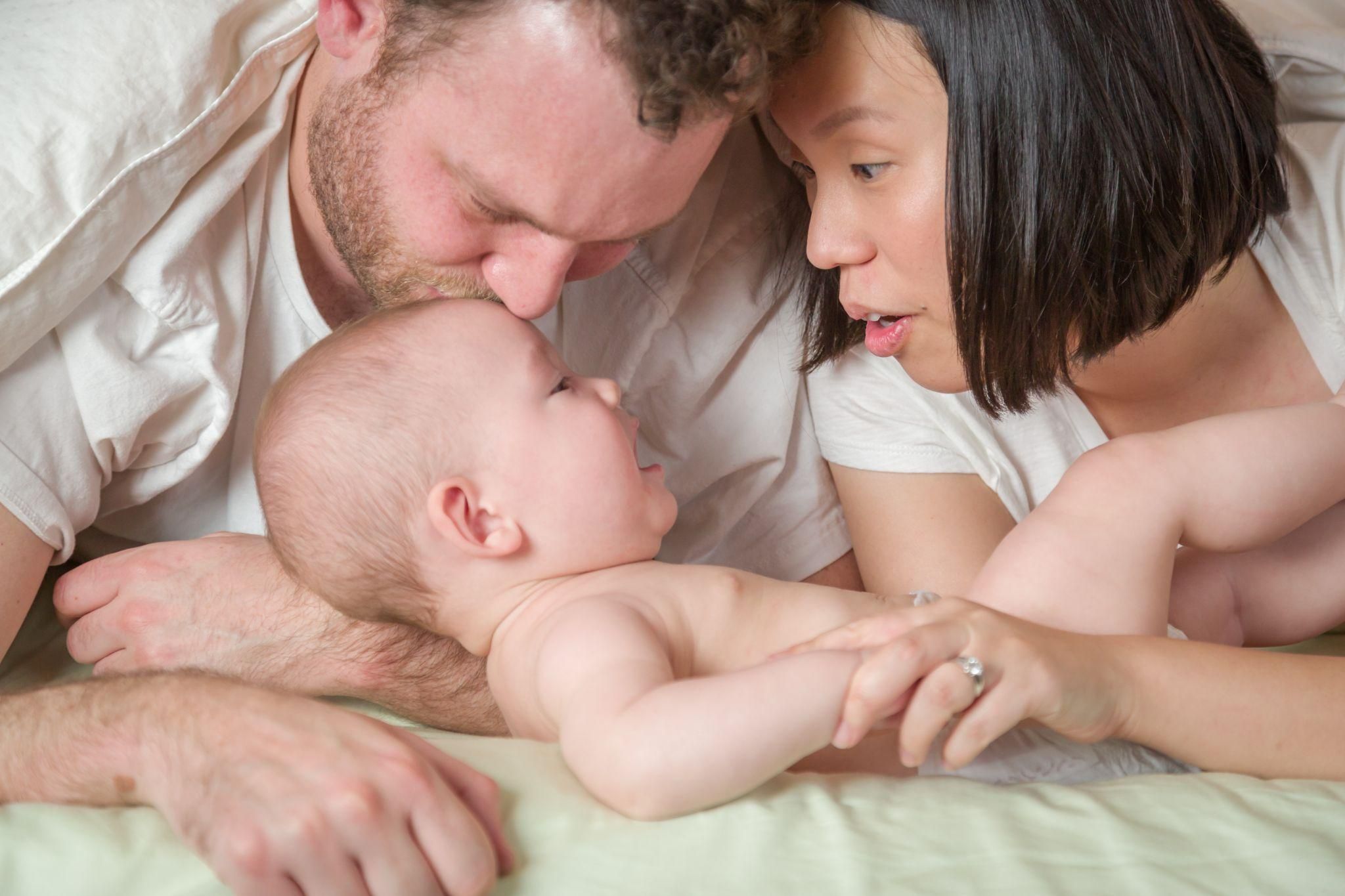 Happy couple with new baby.