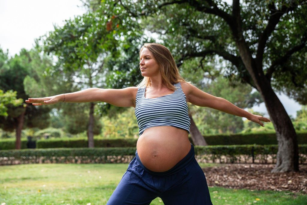 Pregnant woman doing yoga to illustrate antenatal fitness.