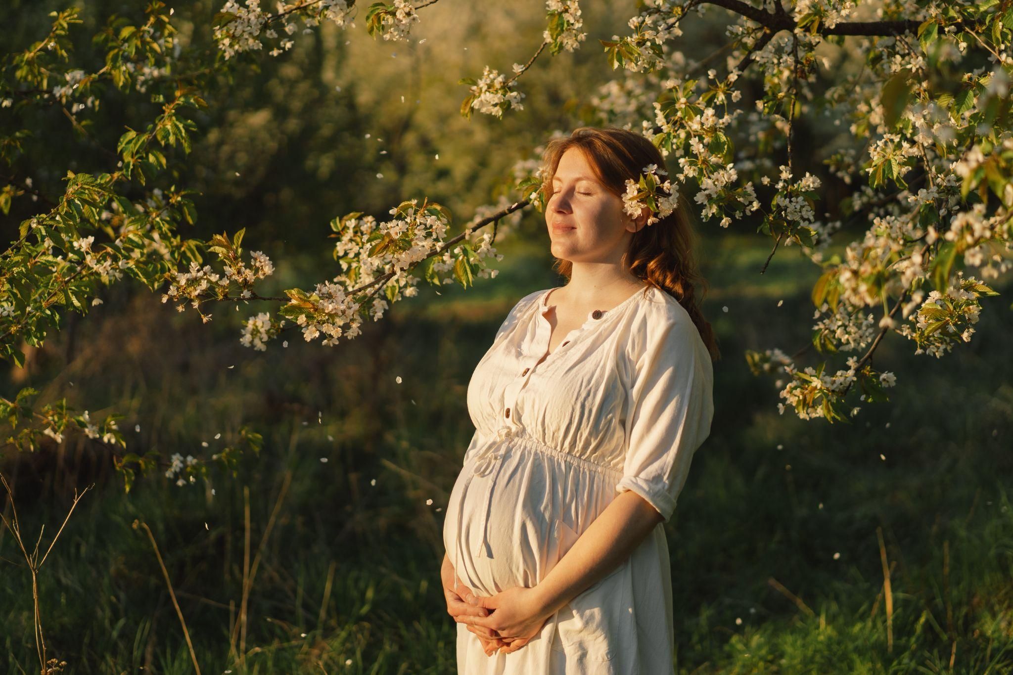 Pregnant woman in labour room, considering pain relief options with partner beside her.