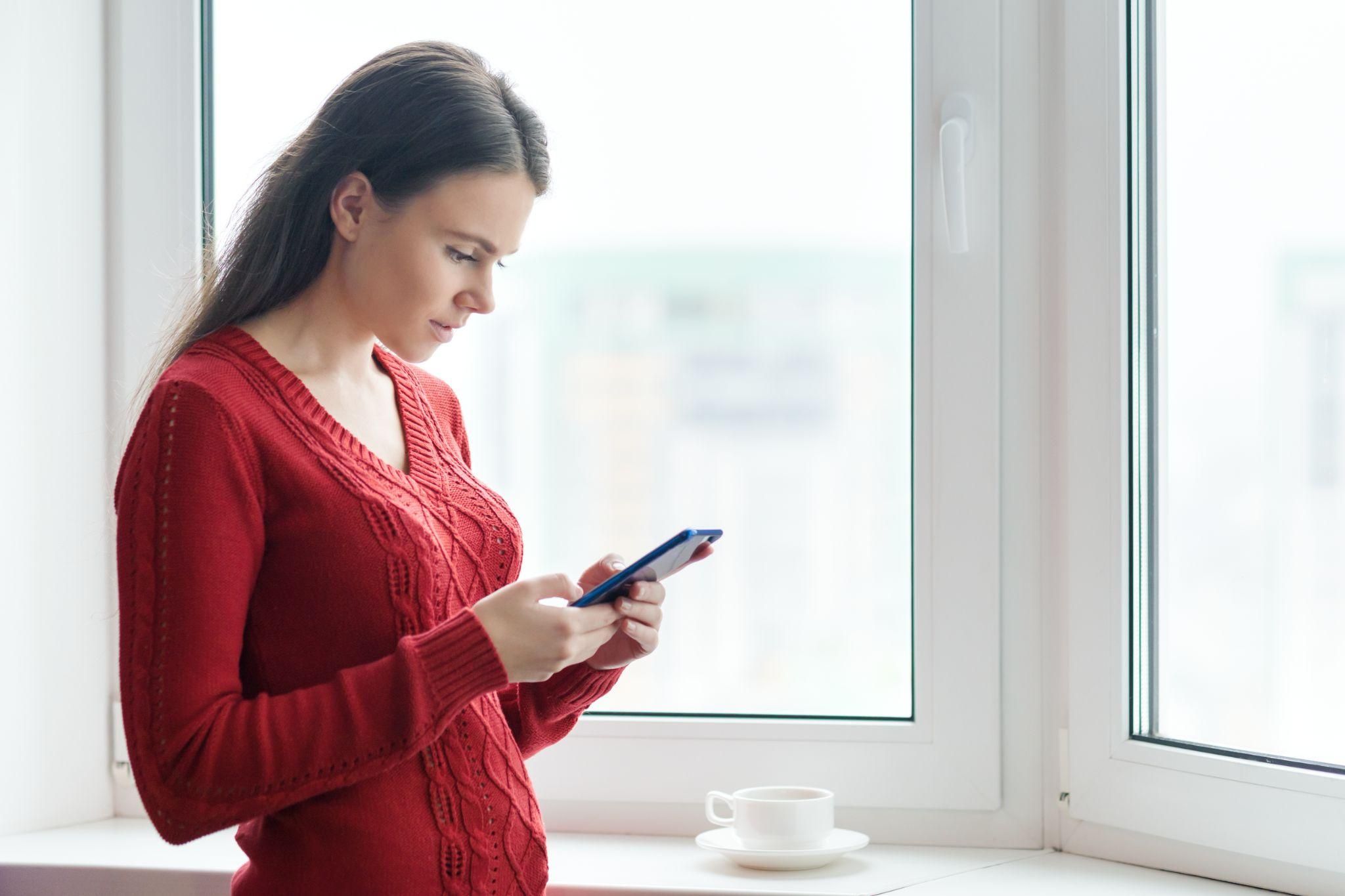 A pregnant woman navigating antenatal self-referral online.