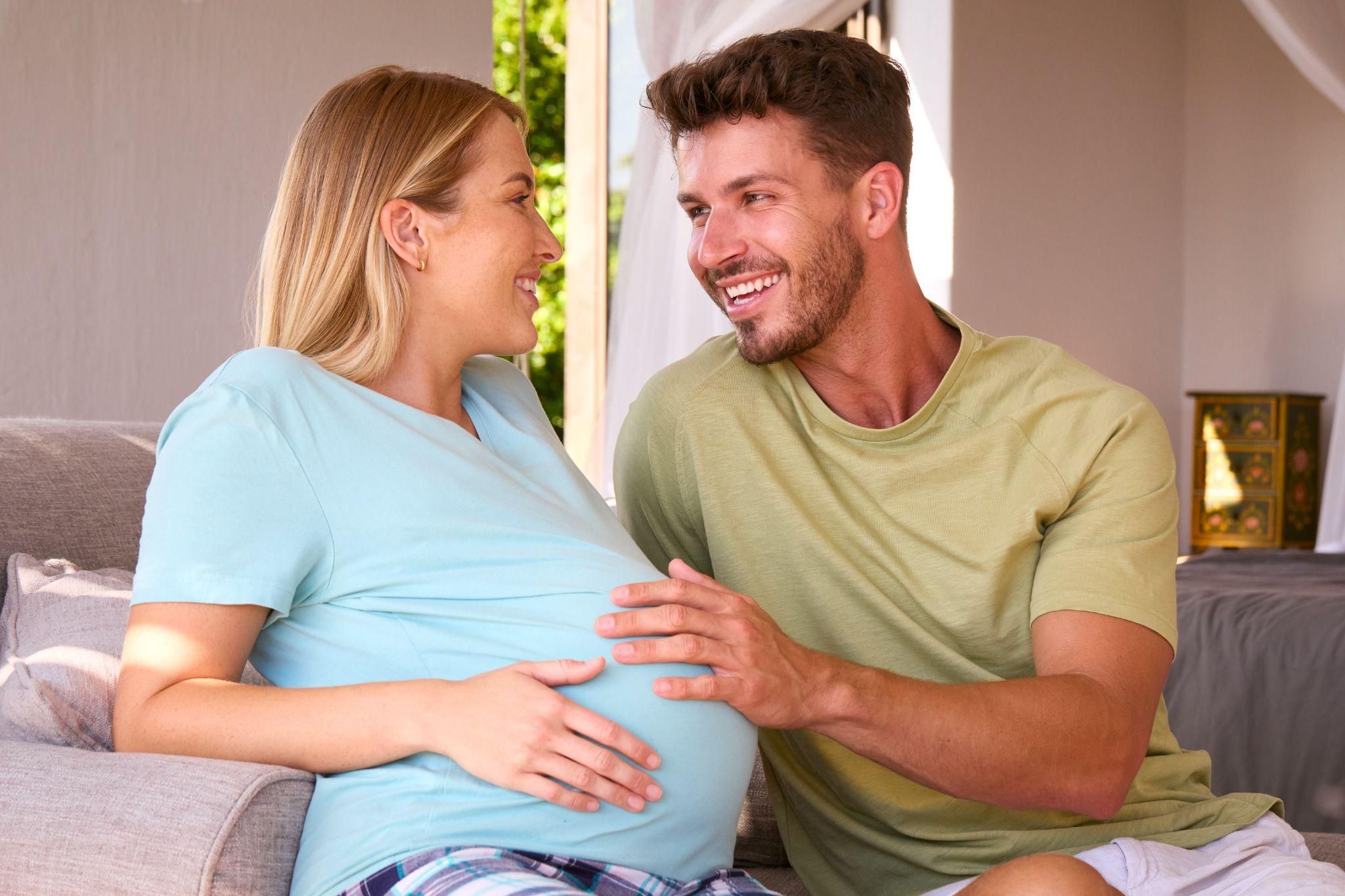 Expectant dad participating in an antenatal class with a group of parents-to-be.