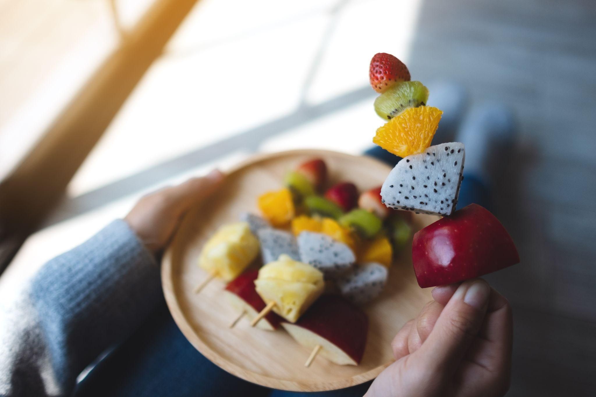 Healthy pregnancy treats including fruit popsicles, dark chocolate, and avocado desserts