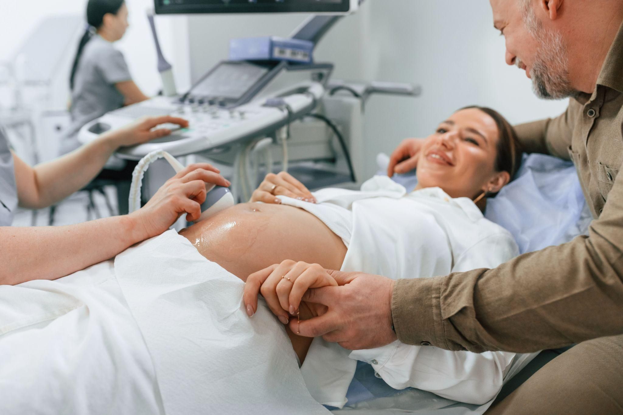 Pregnant woman consulting her midwife during an antenatal monitoring checkup.