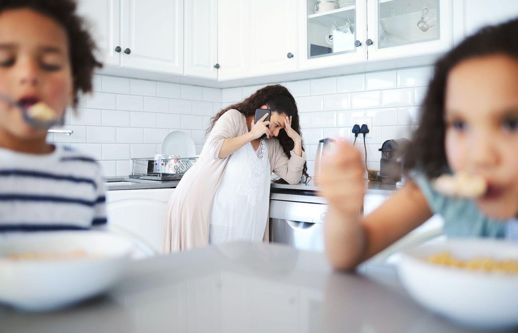 Pregnant woman experiencing emotional stress from critical mother-in-law.