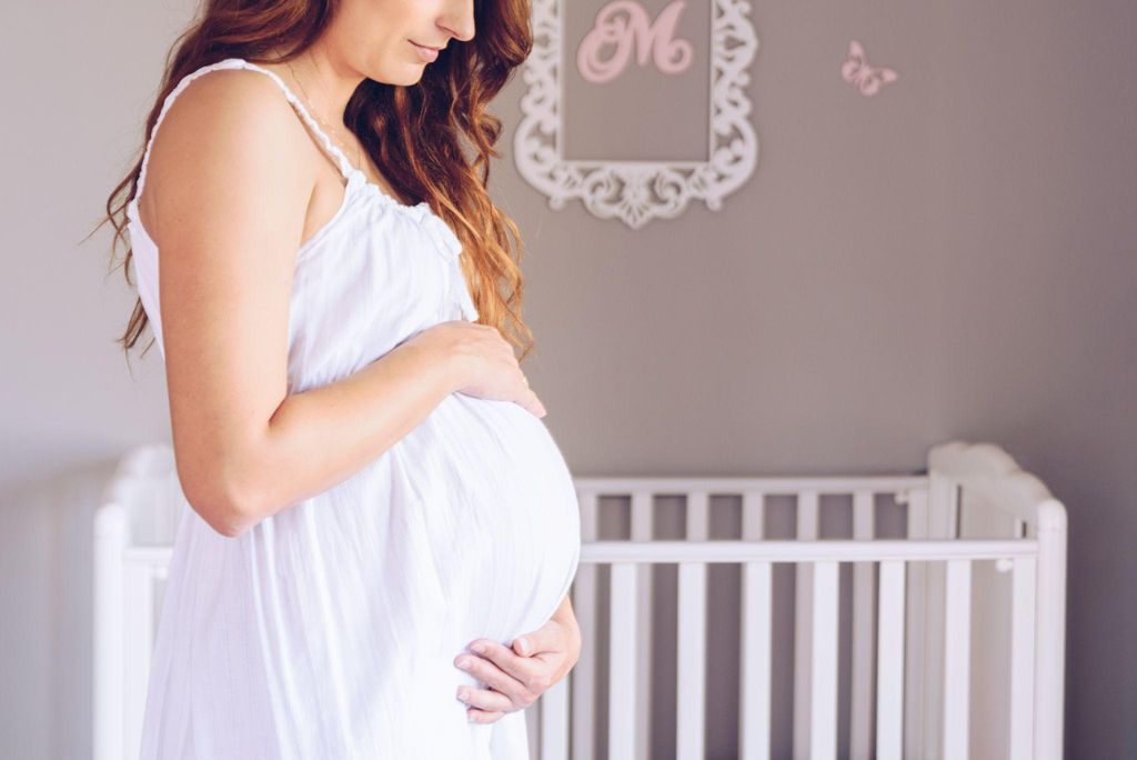 A mother counting her baby’s antenatal movements while relaxing at home.