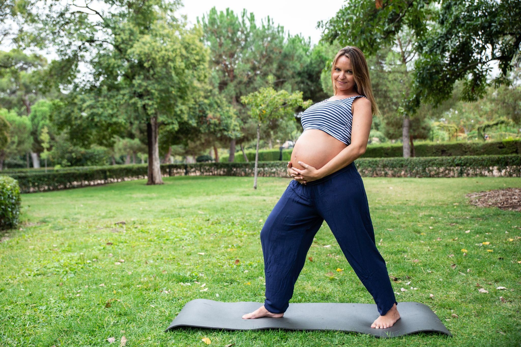 Pregnant woman practising relaxation techniques for labour preparation.