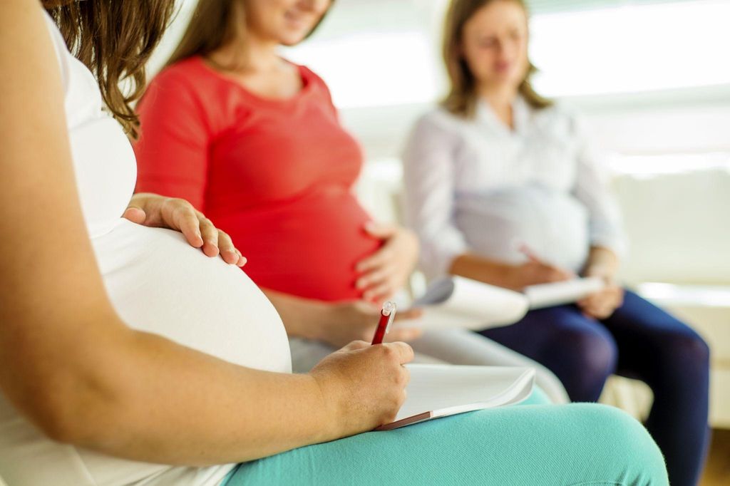 Pregnant woman attending antenatal class