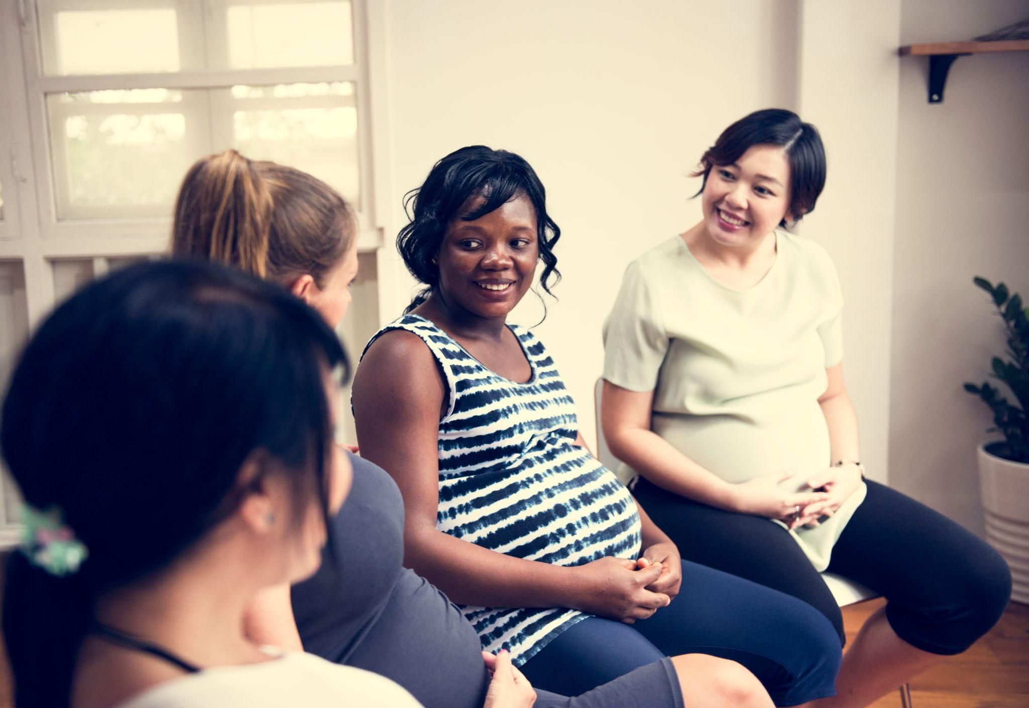 Expectant mother attending an antenatal class with her birth partner to prepare for labour.