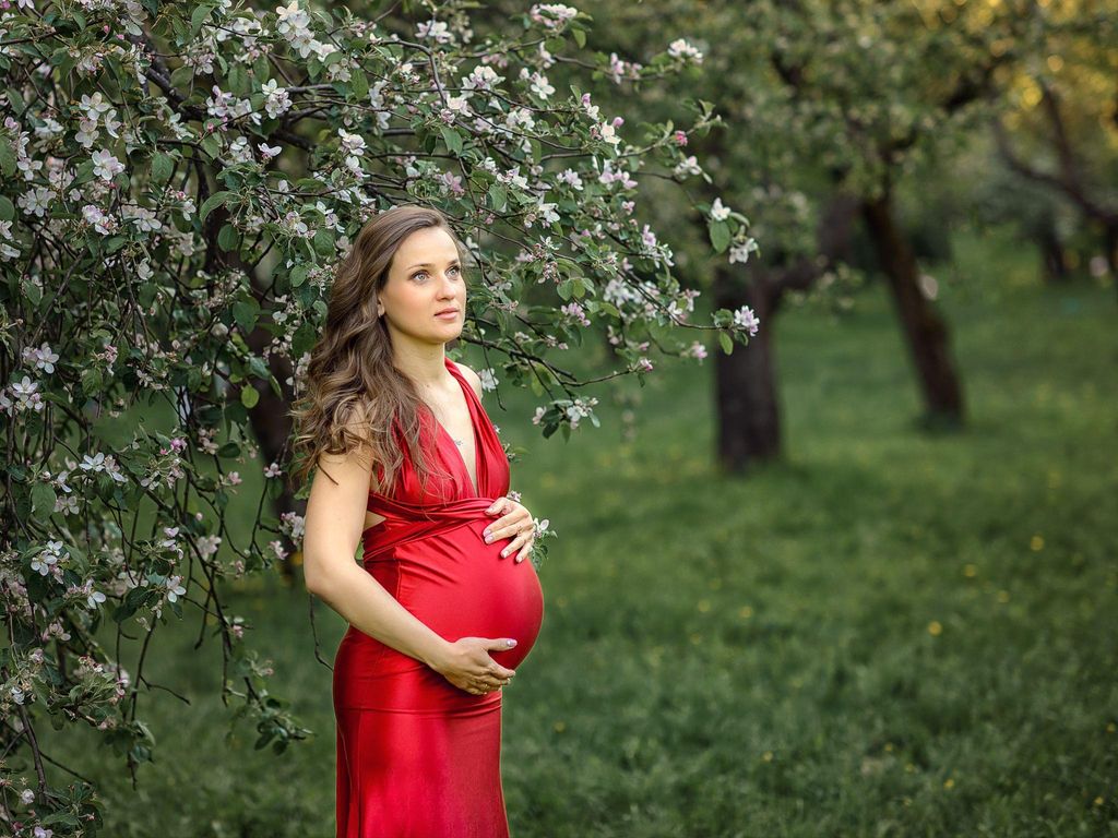 A pregnant woman engaging in yoga during pregnancy to improve flexibility and relaxation.