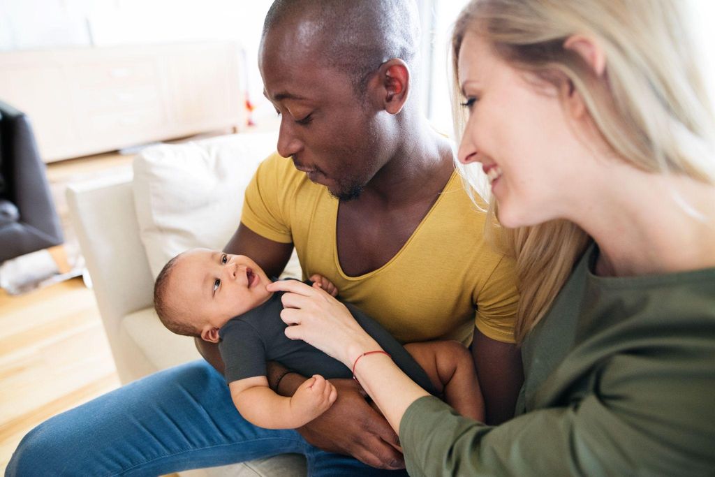 A parent holding their newborn during the postpartum period.